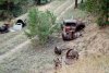 An old truck with other scattered equipment